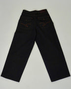 Pair of dark jeans on a light gray background