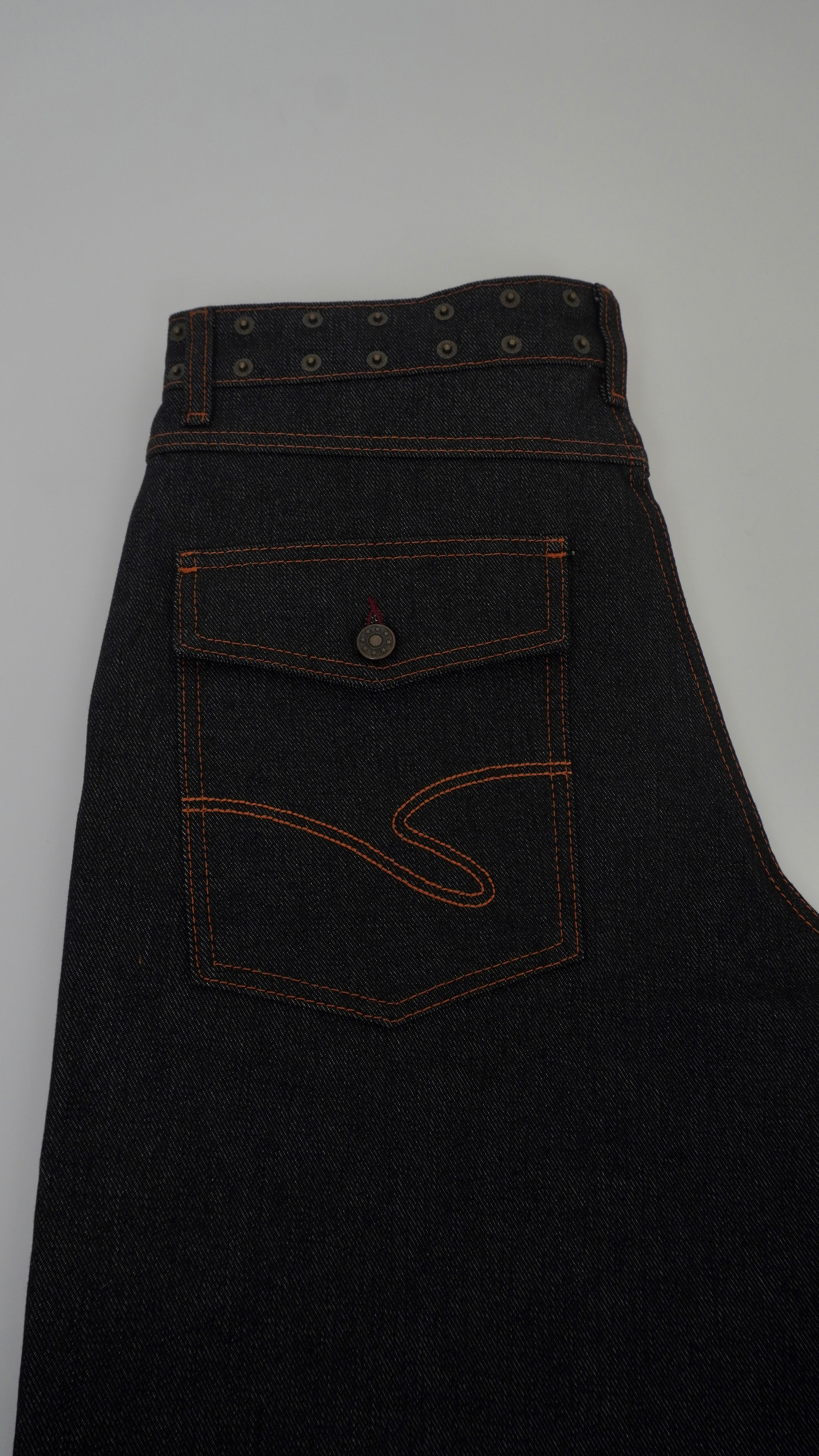 Dark denim apron with a pocket on a light gray background