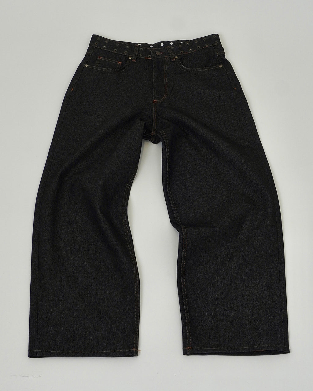 Black jeans on a light gray background