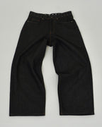 Black jeans on a light gray background