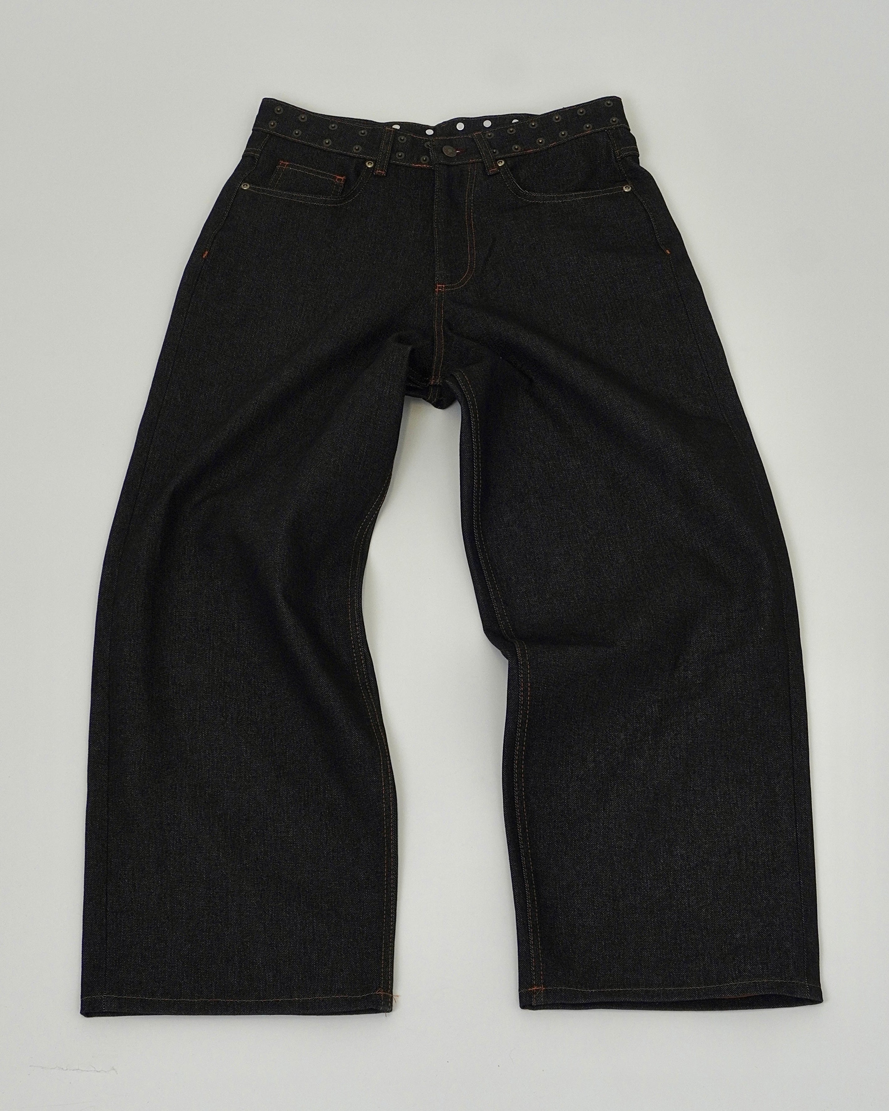 Black jeans on a light gray background